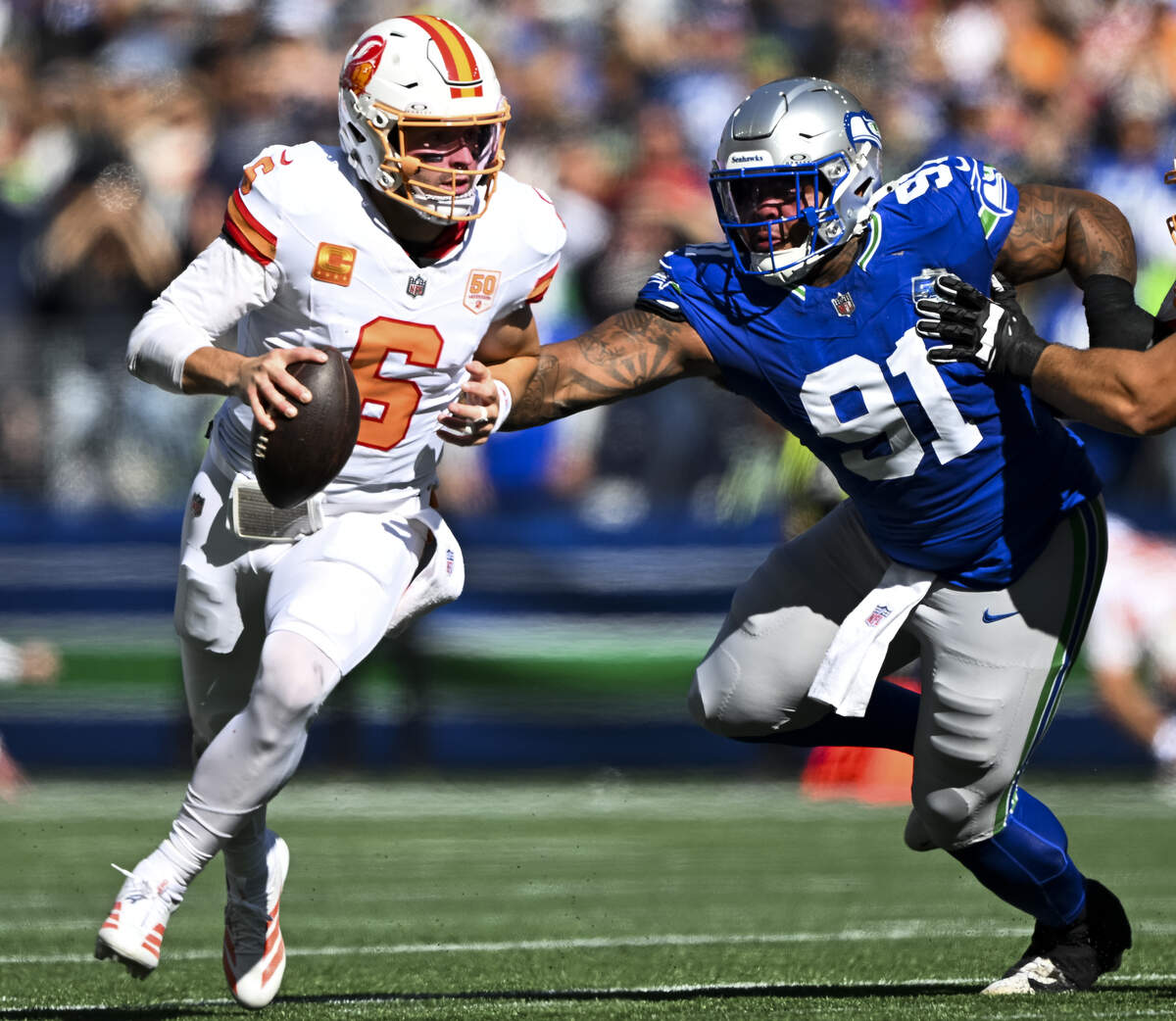 Seattle Seahawks defensive tackle Byron Murphy II (91) nearly gets to Tampa Bay Buccaneers quarterback Baker Mayfield (6) during the first quarter of the game at Lumen Field, on Sunday, Oct. 5, 2025, in Seattle.