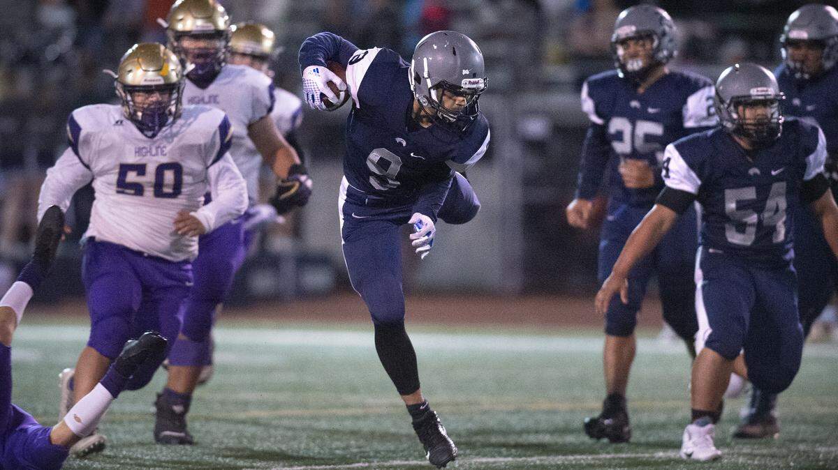 River Ridge running back Jonathon Mapu finds room in the Highline defense during Friday night’s 2A SPSL crossover football game at South Sound Stadium in Lacey on Nov. 1, 2019.