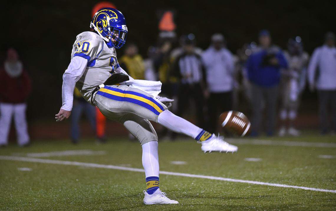 Fife senior punter Gannon Ginnis boots a kick during Friday night’s 2A football state quarterfinal game at Tumwater District Stadium on Nov. 16, 2018.