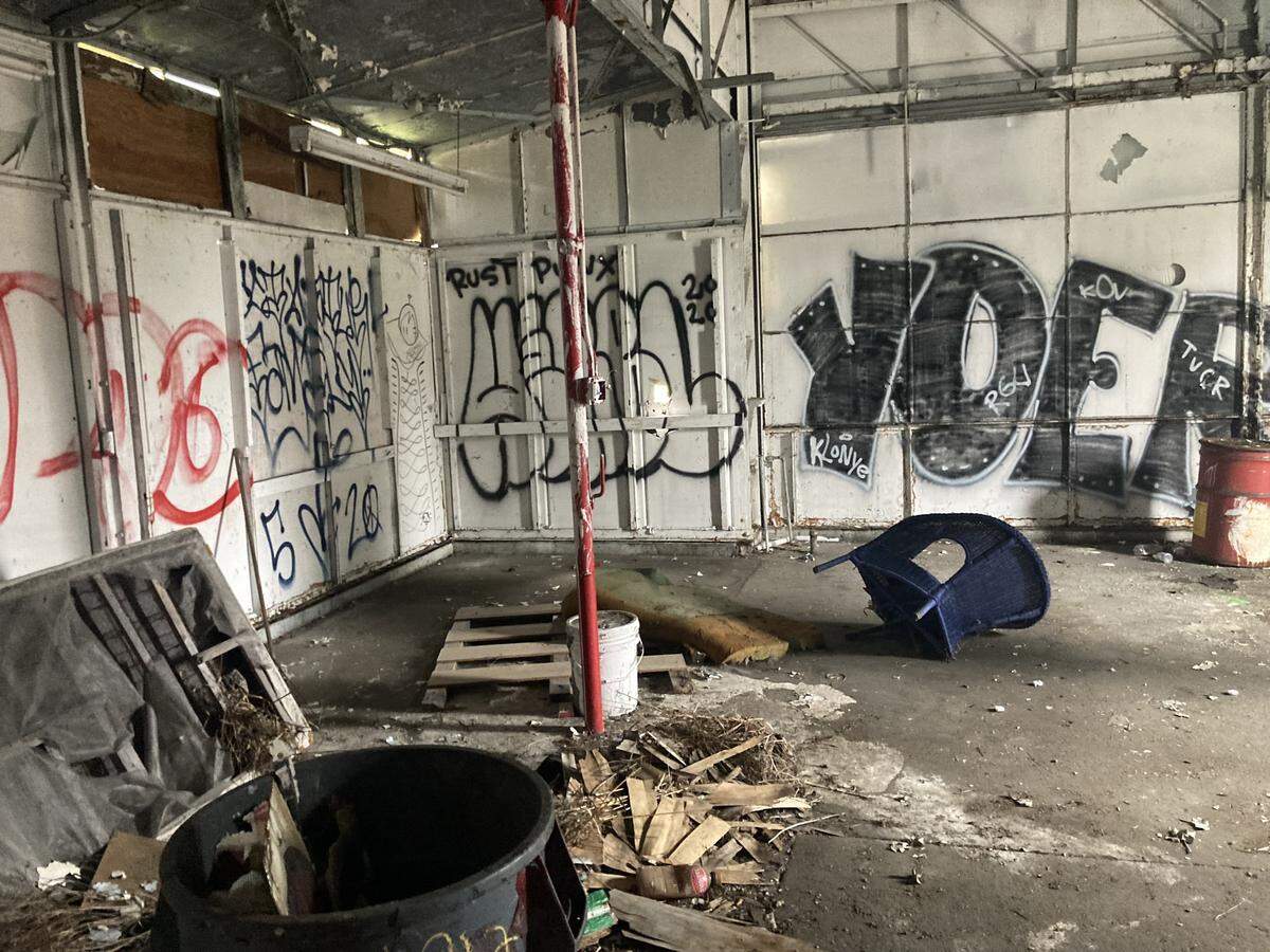 Graffiti plasters the interior walls of the building on the corner of Bethel and San Francisco streets in Olympia. The Northeast Neighborhood Association coordinated with the city to demolish the vacant location Wednesday.