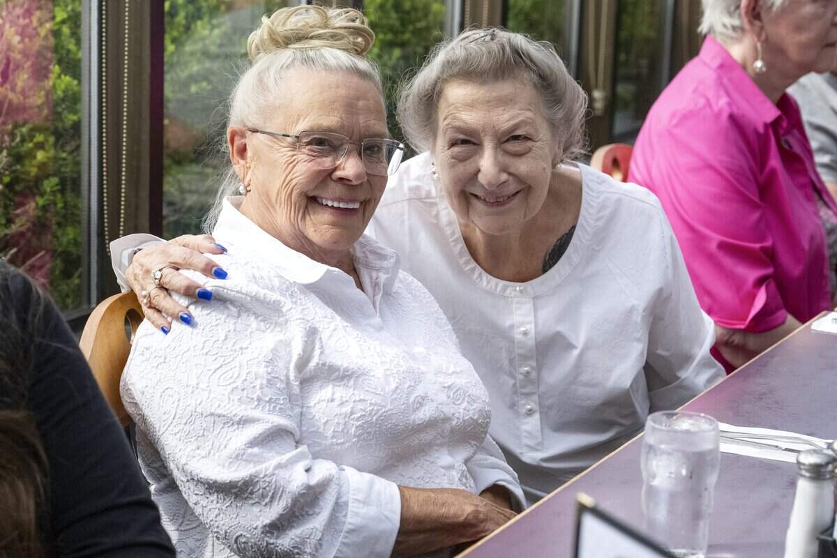 Pamela Lewis, of University Place, left, and Kathleen Phillips, of Tacoma, pose for a photo during a Nice Old Ladies friendship group meet up on Friday, Sept. 12, 2025, at Ben Dews Bar and Grill in Tacoma.