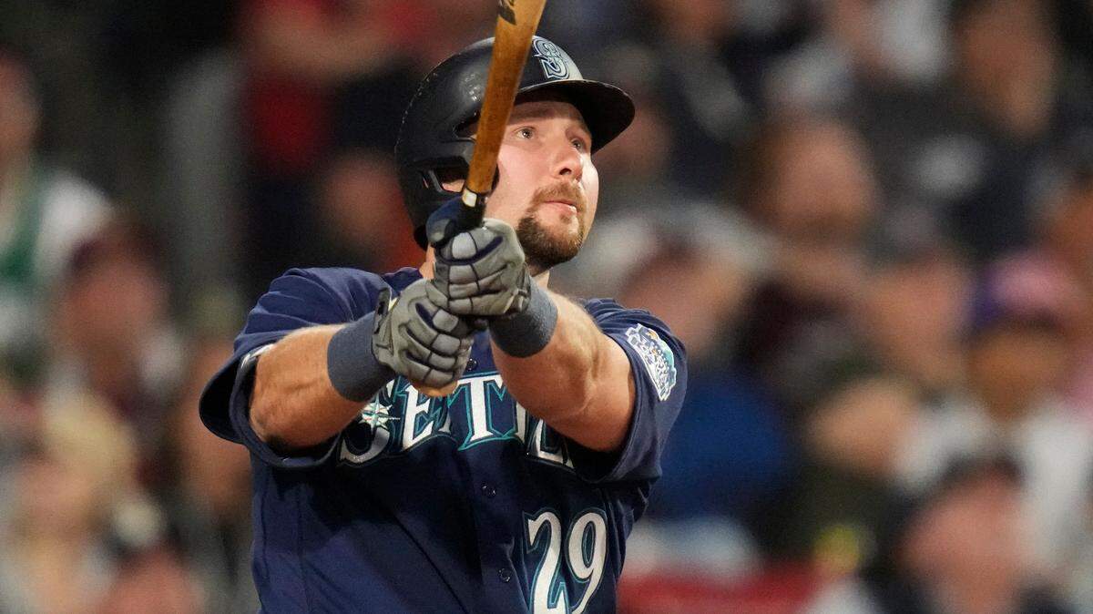 Seattle Mariners’ Cal Raleigh watches the flight of his two-run home run off Boston Red Sox starting pitcher Tanner Houck during the fifth inning of a baseball game at Fenway Park, Monday, May 15, 2023, in Boston. (AP Photo/Charles Krupa)
