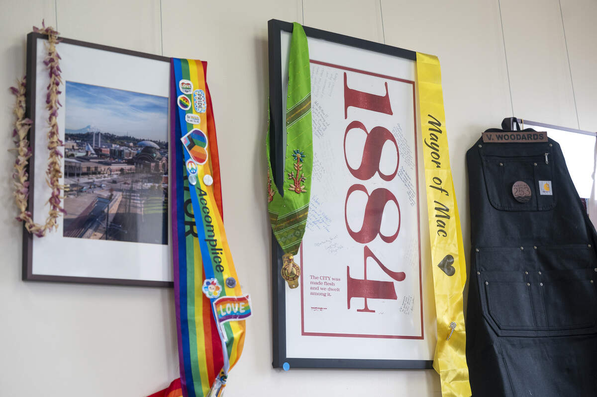 Sashes worn by Tacoma Mayor Victoria Woodards hang in her office on Tuesday, Dec. 16, 2025, in Tacoma, Wash.