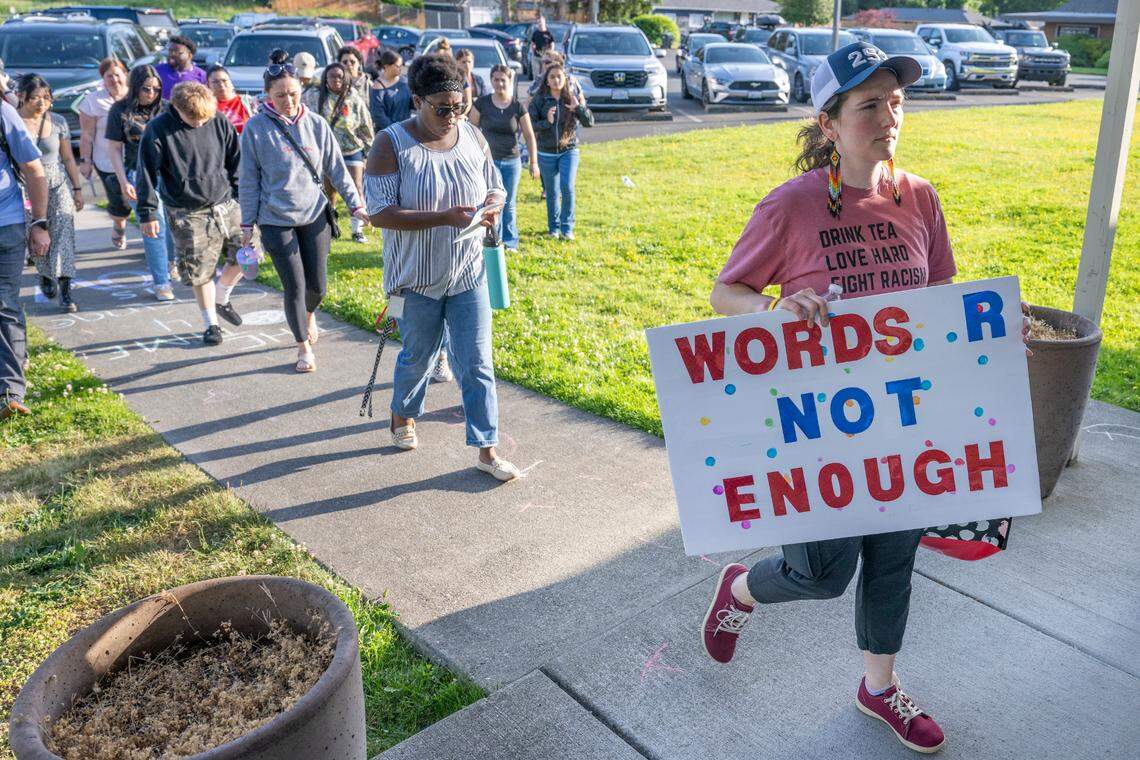Sharon Gold, right, a counseling office coordinator with the Franklin Pierce School District and a candidate for a school board seat in the upcoming election, leads a group into the district’s administrative center to sit in and speak at a school board meeting on Tuesday, June 3, 2025, in Tacoma, Wash. The roughly 30 who spoke called attention to issues like discrimination and budgetary cuts within the district.