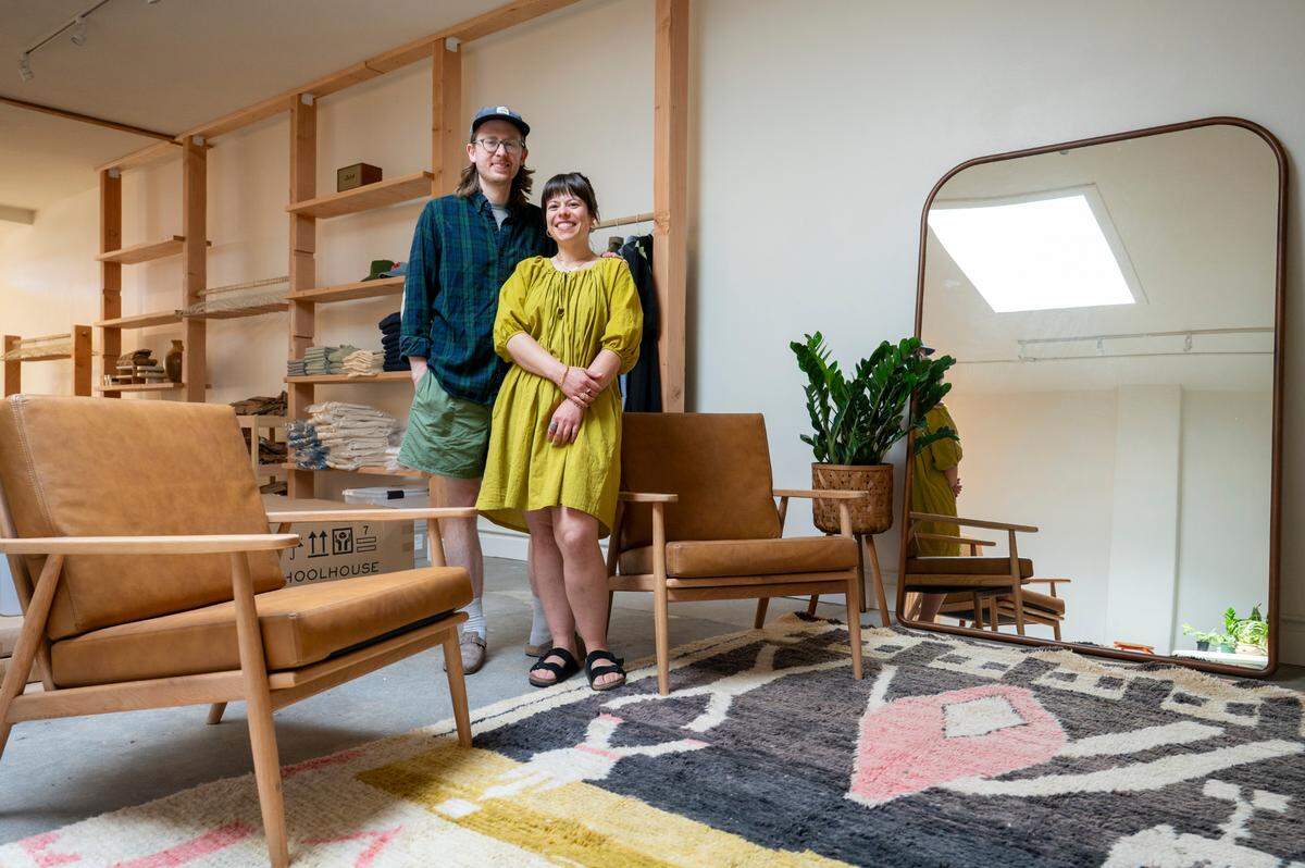 Husband and wife Will Taylor, left, and Ginny McClure stand in Good Luck Shop, McClure’s new clothing and goods store, on Tuesday, June 17, 2025, in the Proctor District of Tacoma, Wash. The Good Luck Shop will host a soft opening on Saturday, June 21.