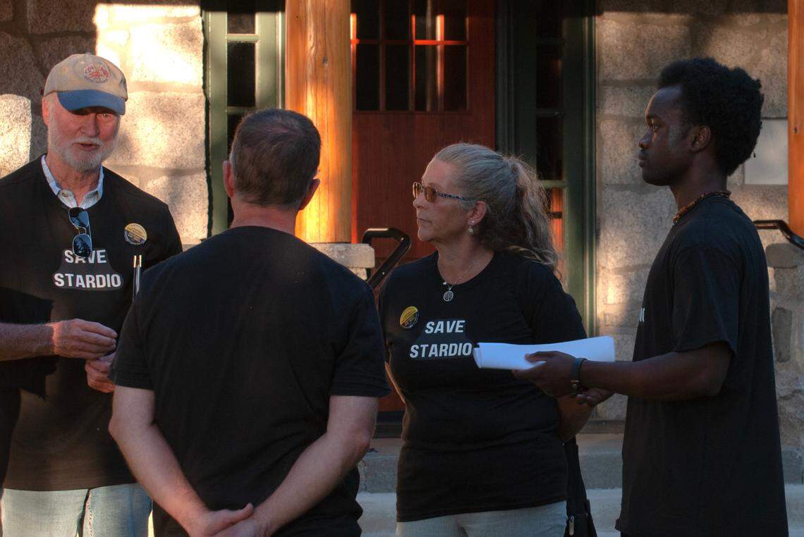 Stardio Wilson (right) stands next to his supporters and former coworkers wearing “Save Stardio” shirts after the Peninsula Metropolitan Park District board meeting on July 18, 2023 at the Arletta Schoolhouse.