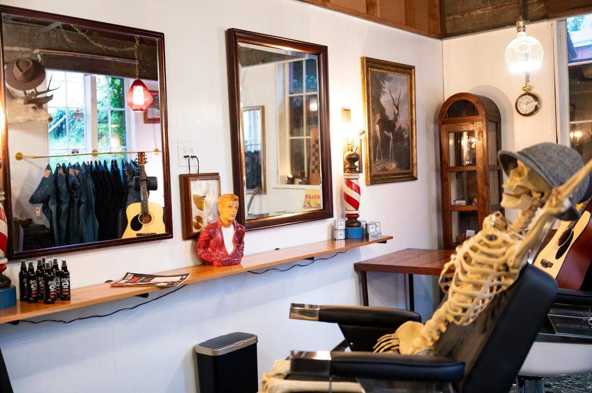 The new speakeasy barbershop in the back of One:11 has everything the modern man needs: clothes, grooming supplies and a cut and shave.