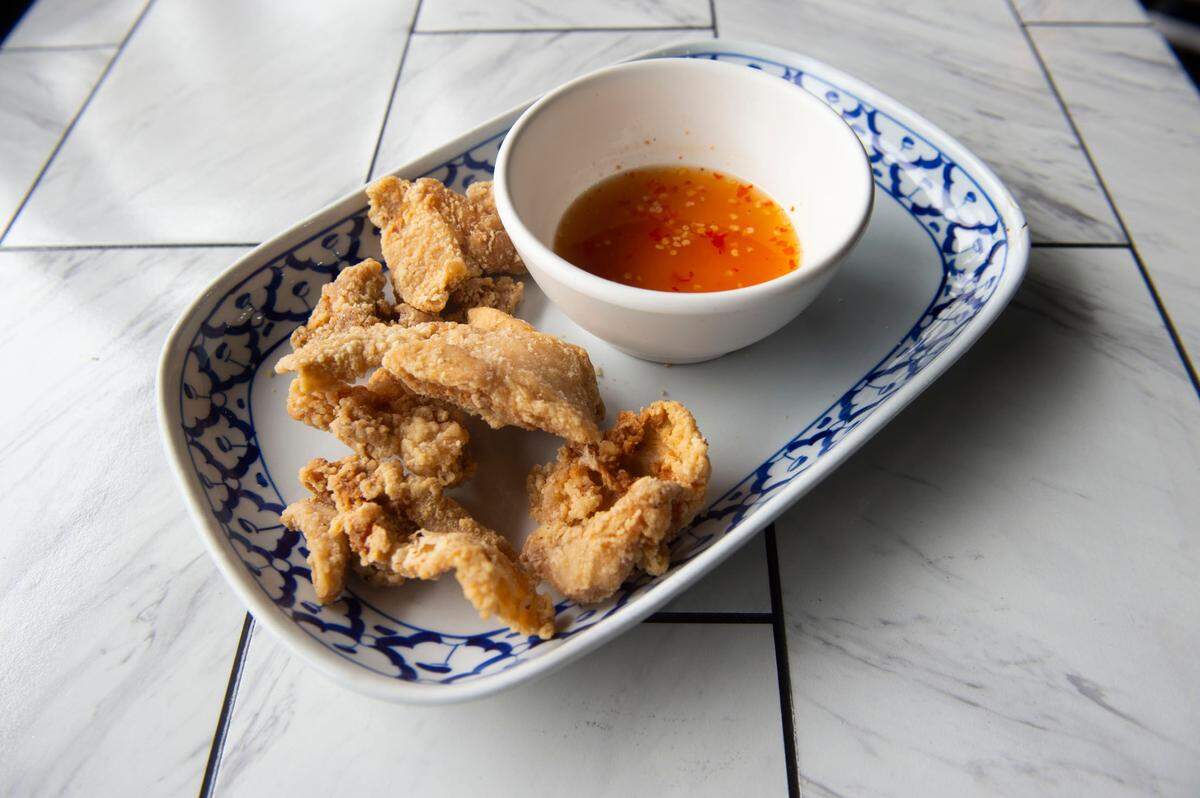 Try dipping Sweet Rice’s crispy chicken skins in jeo som, a tangy sweet-and-sour sauce.