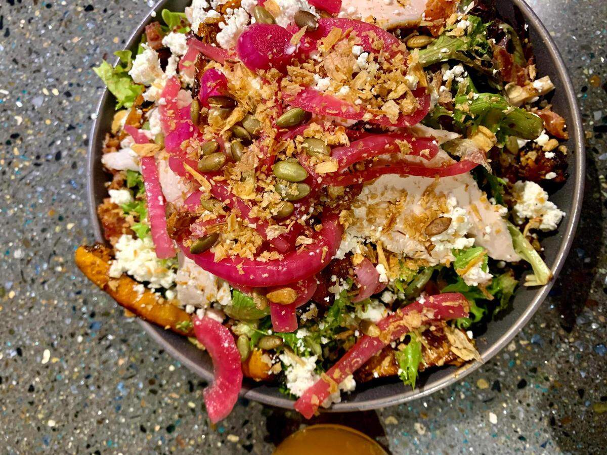 Sig Brewing Co. in Tacoma’s historic brewing district serves stone-oven pizza and a creative spread of plates including this thoughtful, seasonal salad.