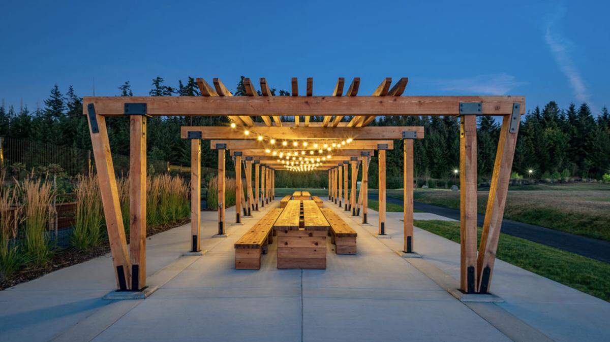 Neighbors can gather below the trellis at Tehaleh’s Discovery Park to socialize and dine.