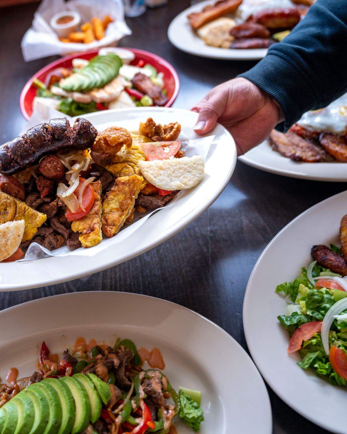 El Parche Colombiano restaurant serves traditional Colombian plates, including the classic picada with a quad of meats, plus empanadas and cocktails at 6324 E McKinley Ave.