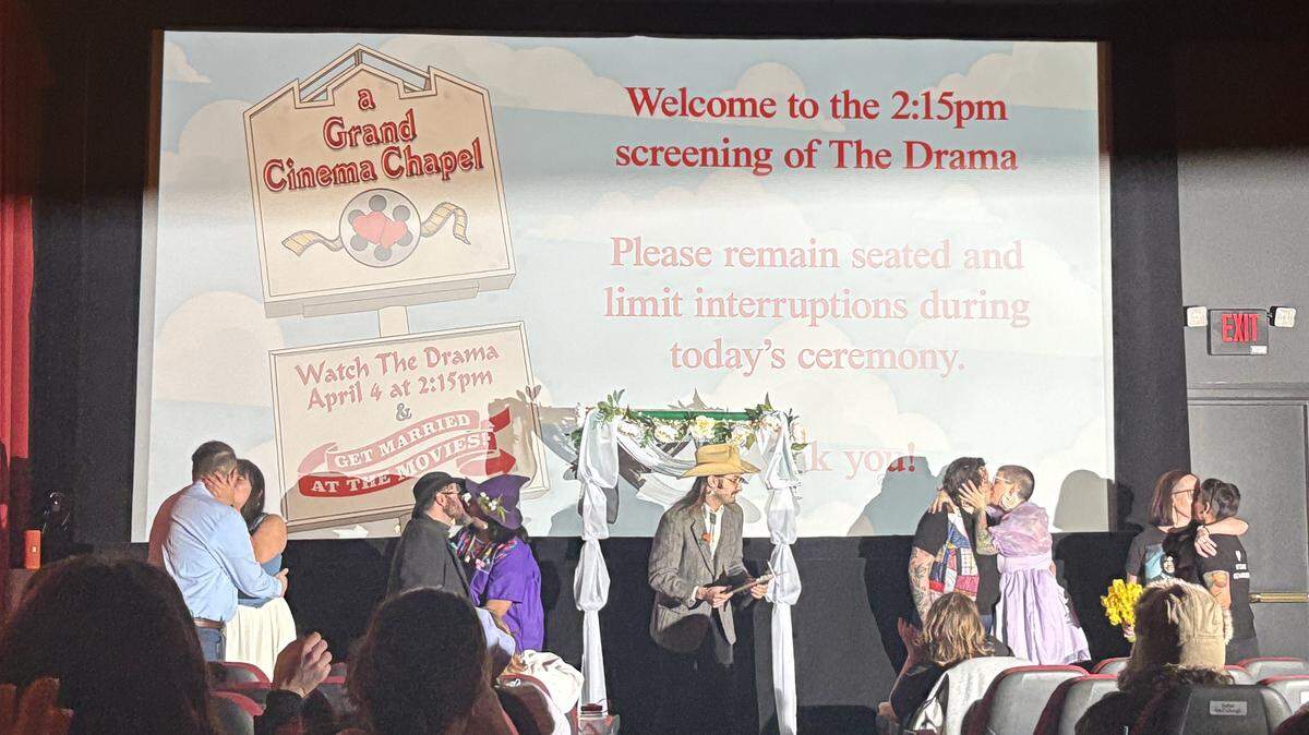 A Grand Cinema theater became a makeshift chapel as couples playfully “tied the knot” before an afternoon screening of “The Drama” on April 4, 2026, in Tacoma.