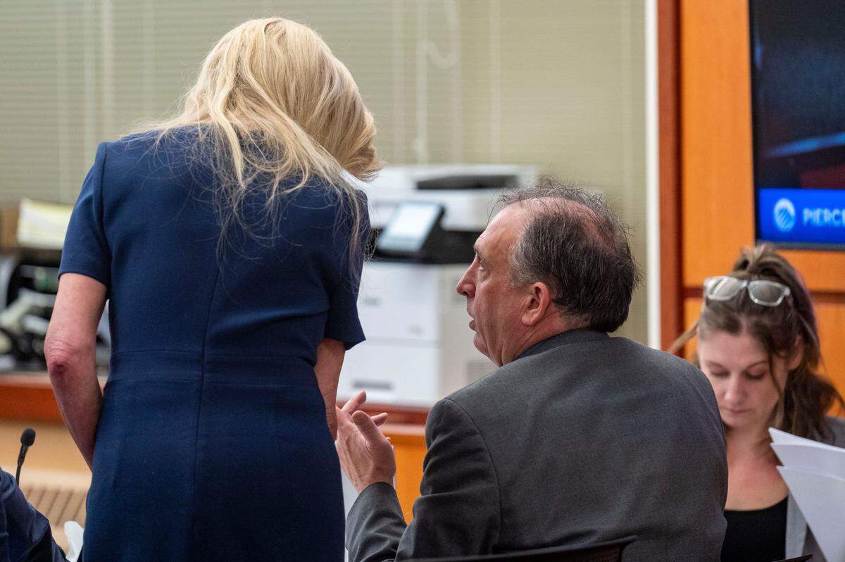 Pierce County Sheriff Ed Troyer talks with his defense attorney Anne Bremner during the testimony of Sedrick Altheimer on Tuesday, Dec. 6, 2022, in Pierce County District Court in Tacoma.
