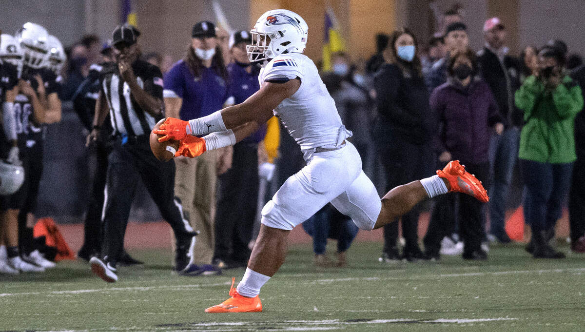 Graham-Kapowsin tight end Andrew Savaiinaea stretches for a pass reception during Saturday night’s 4A SPSL high school football game against the Sumner Spartans at Sunset Chev Stadium in Sumner, Washington, on Oct. 16, 2021.