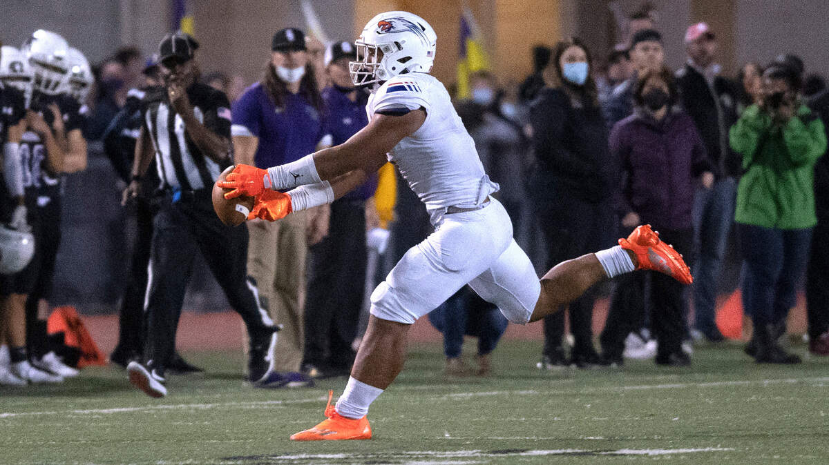 Graham-Kapowsin tight end Andrew Savaiinaea stretches for a pass reception during Saturday night’s 4A SPSL high school football game against the Sumner Spartans at Sunset Chev Stadium in Sumner, Washington, on Oct. 16, 2021.