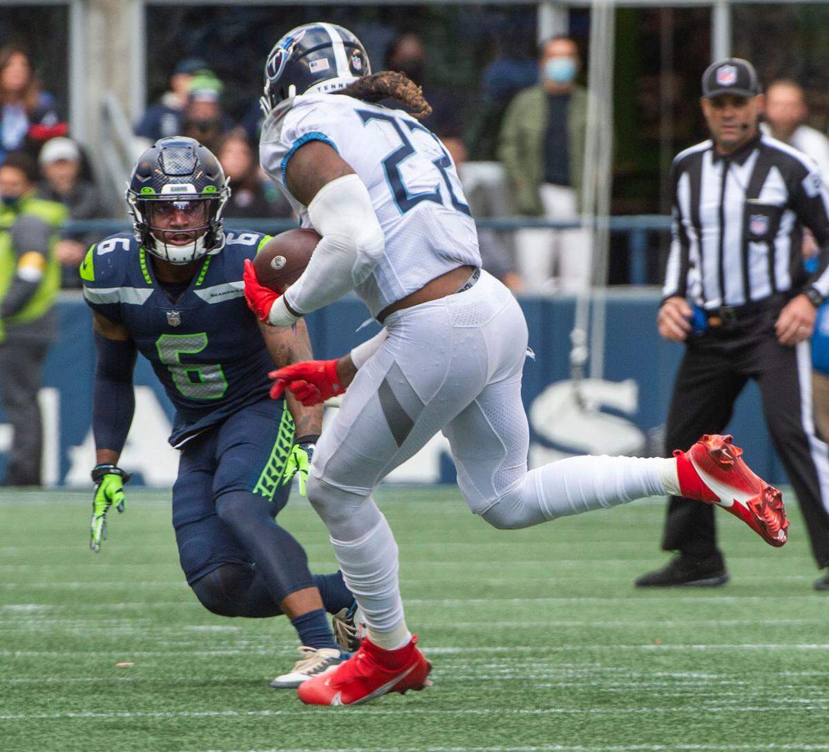 Seahawks safety Quandre Diggs had a bead on the Titans’ Derrick Henry but the running back slipped by for a second-half TD. The Seattle Seahawks played the Tennessee Titans in an NFL football game at Lumen Field in Seattle, Wash., on Sunday, Sept. 19, 2021.