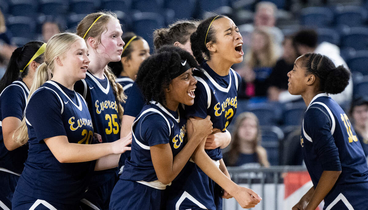 Everett celebrate their victory against Auburn during the first round of the Class 4A state tournament game at the Tacoma Dome, on Wednesday, Feb. 28, 2024, in Tacoma, Wash.