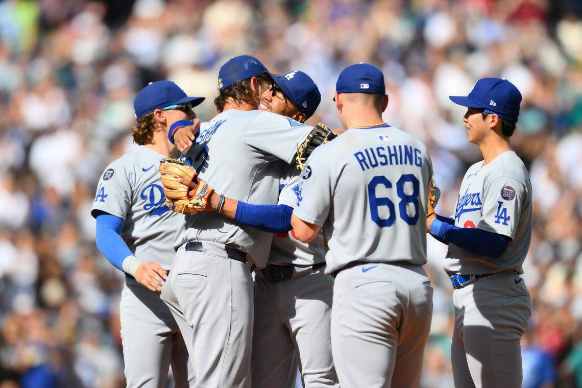 Sep 28, 2025; Seattle, Washington, USA; Los Angeles Dodgers starting pitcher Clayton Kershaw (22) hugs shortstop Mookie Betts (50) before leaving the pitchers mound during the sixth inning against the Seattle Mariners at T-Mobile Park. Mandatory Credit: Steven Bisig-Imagn Images