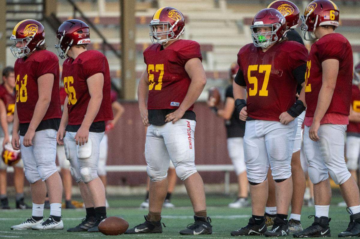 Enumclaw center Zeke Luchi (67) prepares for team offensive drills at practice on Wednesday, Aug. 24, 2022, in Enumclaw, Wash.