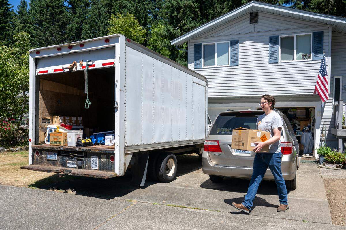 Travis Kienholz carries equipment for the upcoming Red White and Kaboom fireworks show to a trailer on Tuesday, July 1, 2025, in Puyallup.