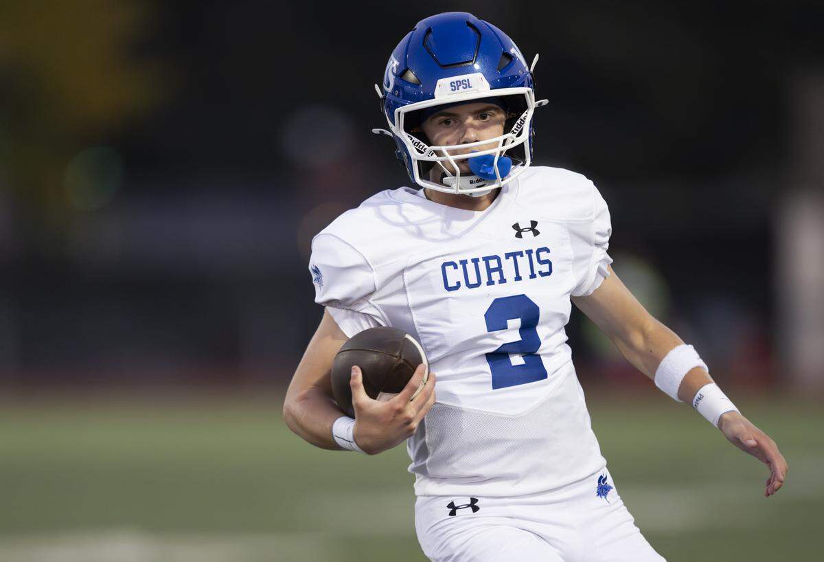 Curtis quarterback Samuel Patterson (2) scrambles on the keeper against the Lakes Lancers during the first half of the game at Harry Lang Stadium, on Friday, Sept. 19, 2025, in Lakewood, Wash.