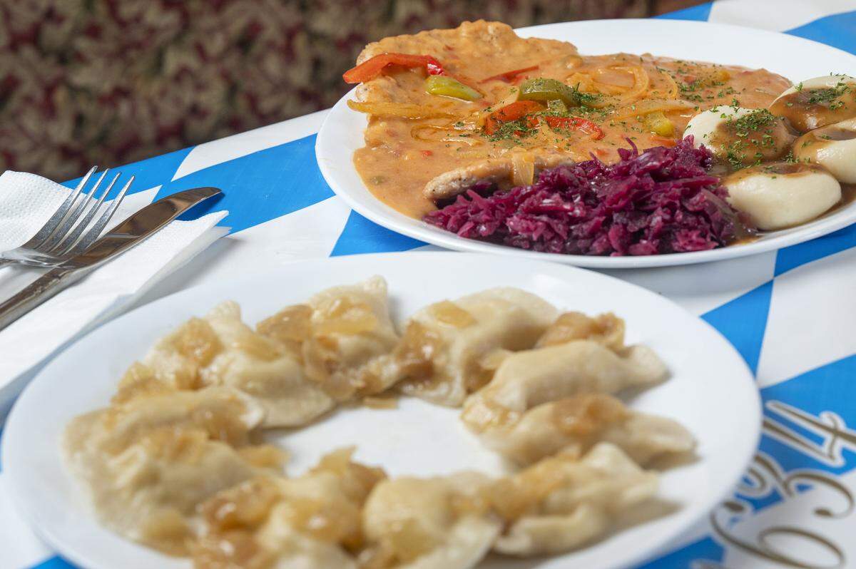 A plate of potato and cheese pierogi, front, and zigeunerschnitzel with dumplings and cabbage, are pictured at Bruno's European Restaurant on Wednesday, Oct. 8, 2025, in Lakewood, Wash.