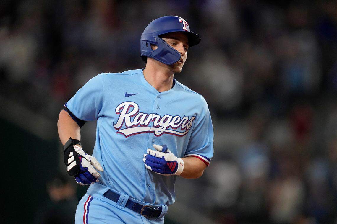Texas Rangers’ Corey Seager rounds the bases after hitting a two-run home run in the third inning of a baseball game against the Seattle Mariners, Sunday, Sept. 24, 2023, in Arlington, Texas. Leody Taveras also scored on the play. (AP Photo/Tony Gutierrez)
