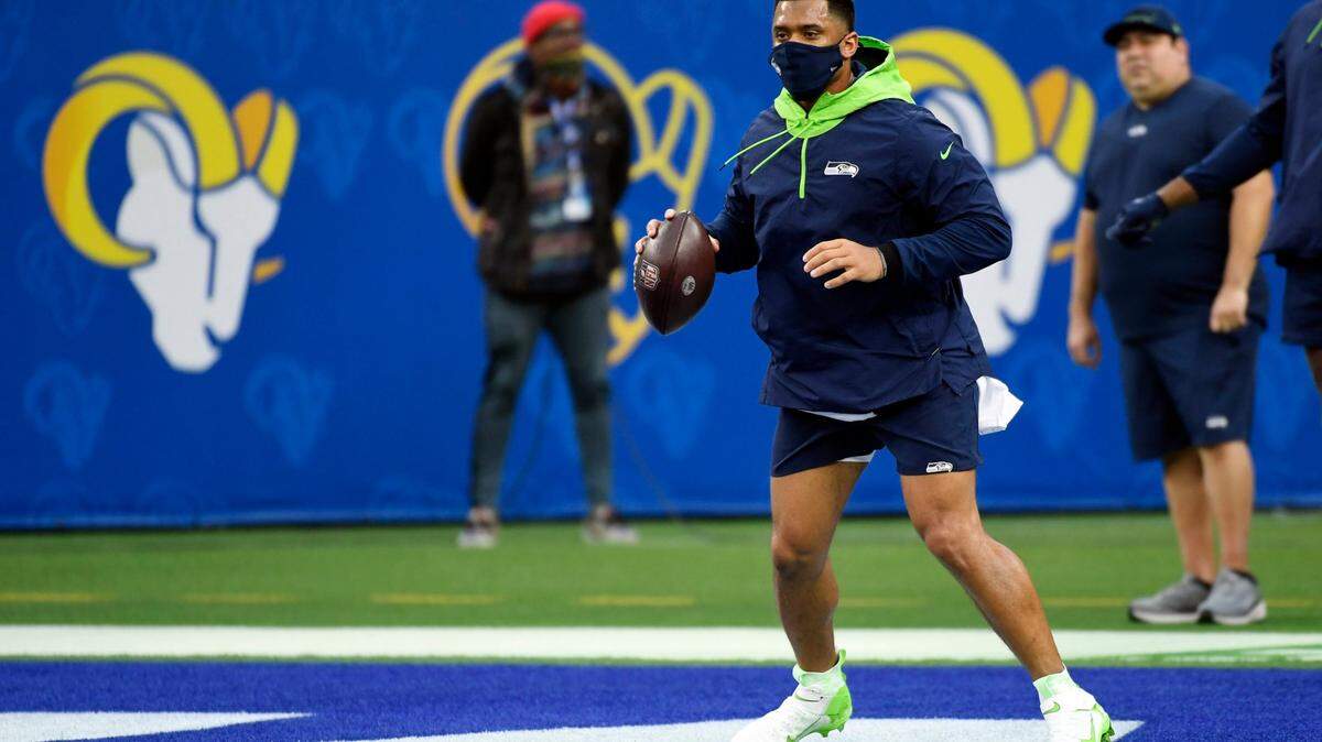 Seattle Seahawks quarterback Russell Wilson warms up before an NFL football game against the Los Angeles Rams Tuesday, Dec. 21, 2021, in Inglewood, Calif. (AP Photo/Kevork Djansezian)