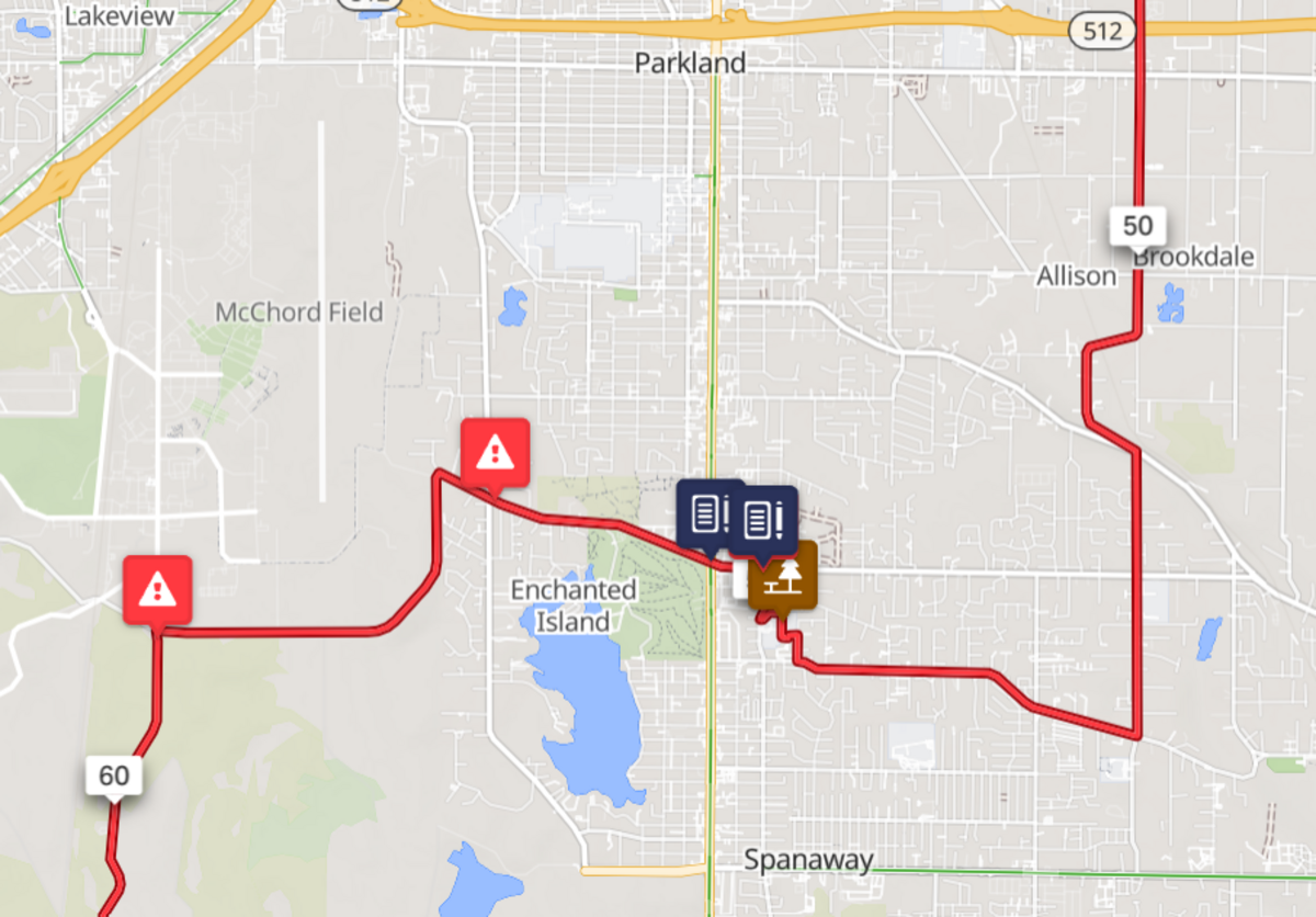 The route goes through Parkland and Spanaway. Red balloons indicate construction disturbance. Blue balloons indicate police presence. Brown balloon indicate rest stops.