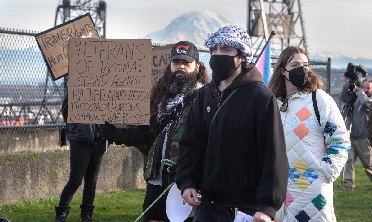 Jeff Chapdelaine, an Army veteran from Tacoma, joined about 350 protesters gathered to oppose a variety of concerns - including the Trump agenda and the war in Gaza - during the “End the Attacks on the People!” protest rally at Fireman’s Park in downtown Tacoma, Washington, on Monday, Jan. 20, 2025.