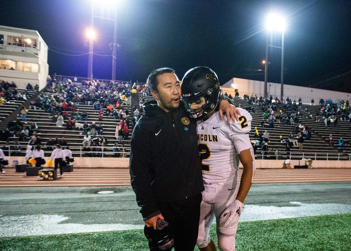 Lincoln’s Masaki Matsumoto speaks with Lincoln’s Jeddiah Hayes (2) after Hayes’ game-sealing interception during the fourth quarter. Lincoln played Bethel in a a football game at the Lincoln Bowl in Tacoma, Wash., on Friday, Nov. 1, 2019.