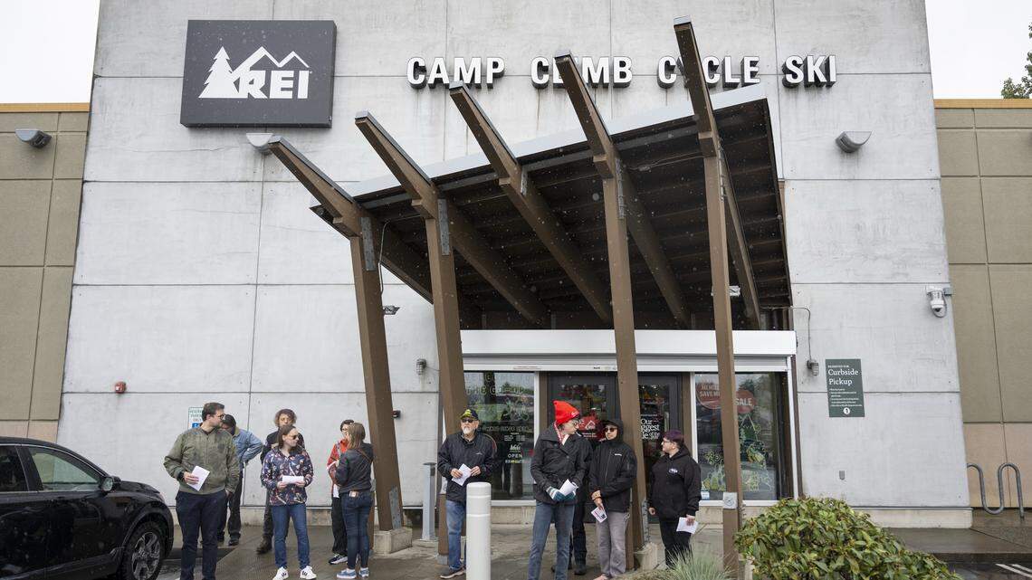 Labor advocates picket outside Tacoma REI amid its largest annual sale