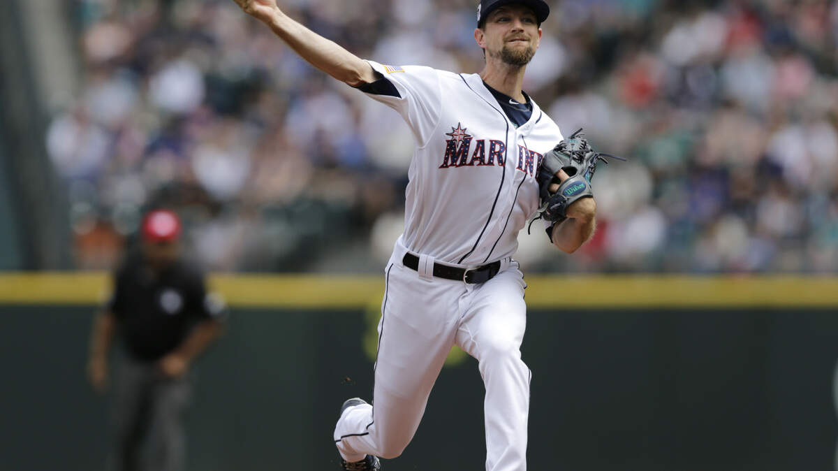Seattle Mariners starting pitcher Mike Leake works against the Los Angeles Angels during the first inning of a baseball game, Wednesday, July 4, 2018, in Seattle. (AP Photo/John Froschauer)