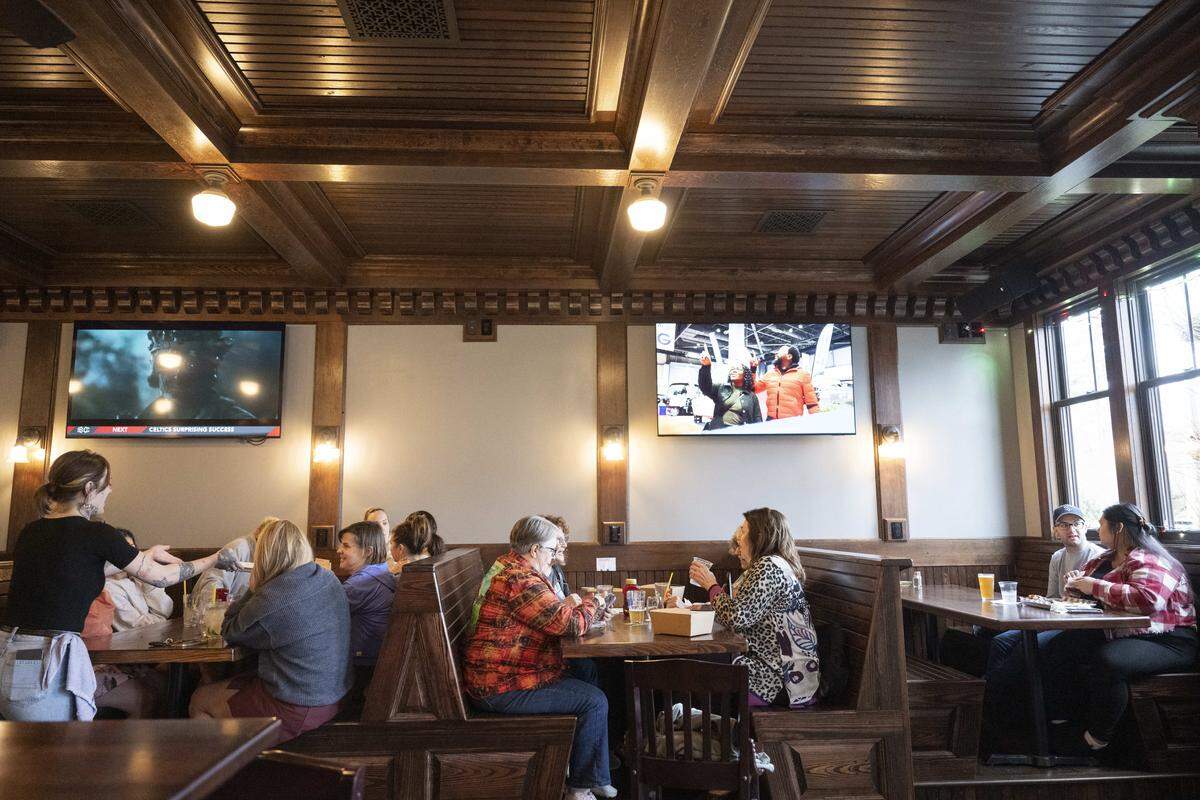 Guests sit in long wooden booths at Terry's Bar and Grill on Wednesday, Jan. 7, 2026, in Tacoma, Wash.