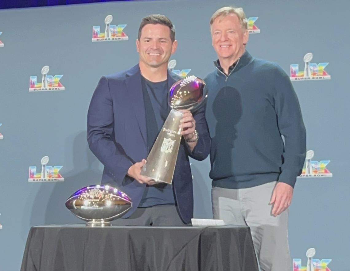 Seahawks coach Mike Macdonald (left) holds the Vince Lombardi Trophy alongside NFL commissioner Roger Goodell during a press conference at the Moscone Center in San Francisco Monday, Feb. 9, 2026, the day after Seattle won Super Bowl 60, 29-13 over the New England Patriots.