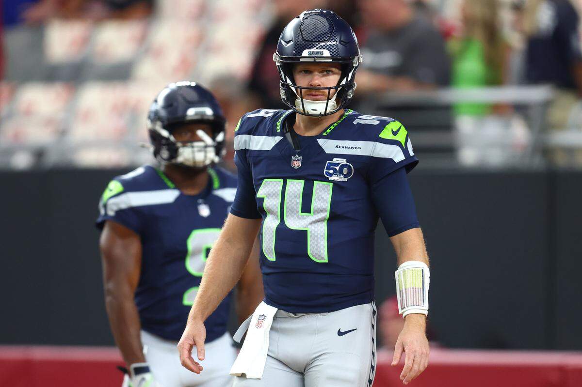 Seattle Seahawks quarterback Sam Darnold (14) looks on before the game against the Arizona Cardinals at State Farm Stadium. Mandatory Credit: Mark J. Rebilas-Imagn Images
