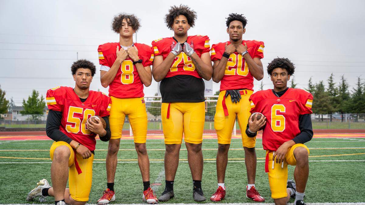 From left, Mount Tahoma varsity football players offensive lineman Maceo Monroe, quarterback Derrik McKinney, offensive lineman Marquise Thorpe-Taylor, outside linebacker Jah-Jah Abdullah and wide receiver Josiah Maxi-Johnson pose for a portrait on the field at Mount Tahoma High School in Tacoma, Wash. on Oct. 5, 2022.