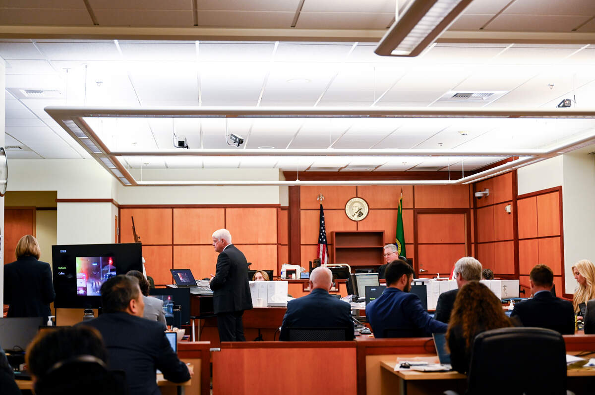 Grant Fredericks, a certified forensic video analyst for a company in Spokane, shows video evidence to the jury Monday during the trial of three Tacoma police officers in the killing of Manny Ellis.