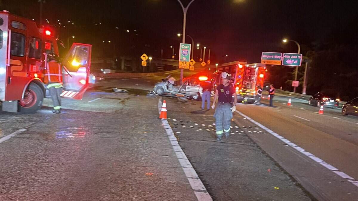 Emergency personnel work the scene of a suspected DUI car crash on Interstate 5 in Seattle that injured a 49-year-old Buckley woman who was in the passenger’s seat on Friday, Dec. 20, 2024.