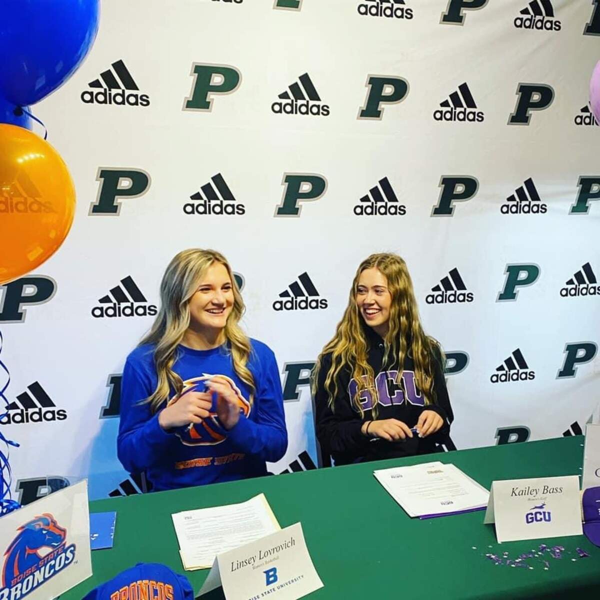 Peninsula High School Linsey Lovrovich, left, and Kailey Bass signed their National letters of intent to play sports at the next level. Lovrovich will join the Boise State basketball team, while Bass will play her college golf for Grand Canyon University.