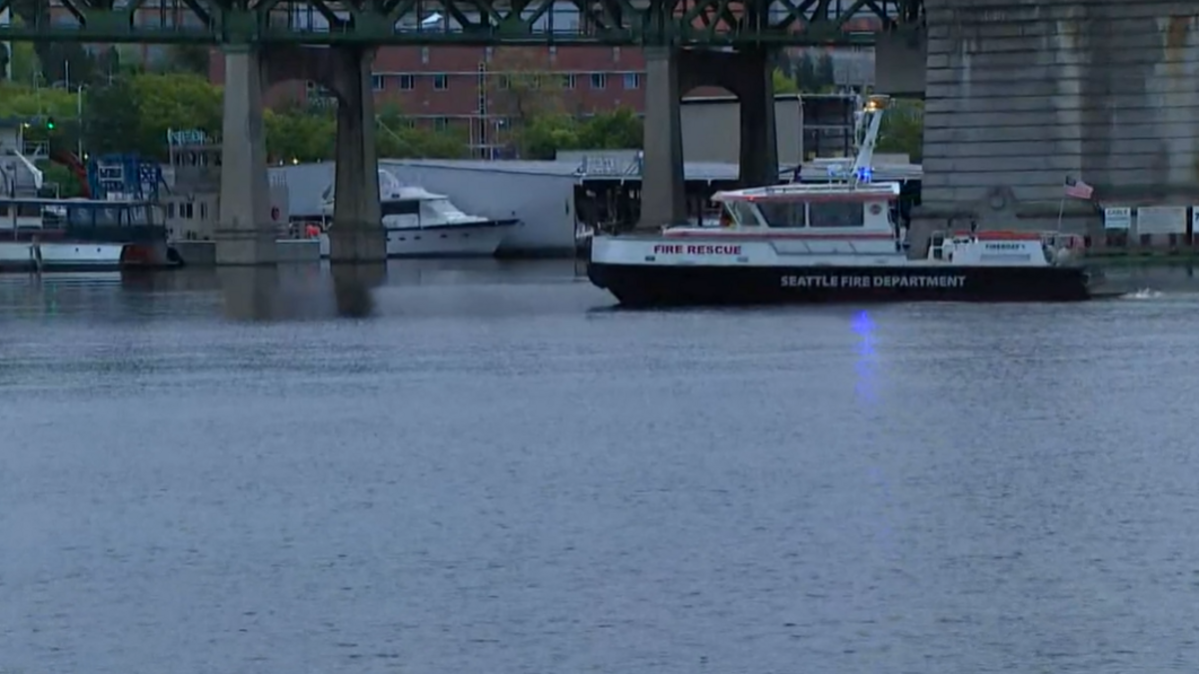 Rescuers searched for a missing man on May 24, 2022, after he was knocked over the Ship Canal Bridge in Seattle during a crash, authorities said. The man’s body was recovered about four hours after the incident.