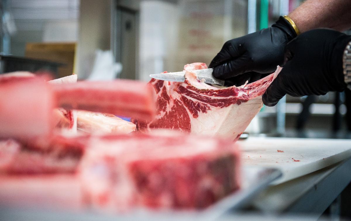 Chef-owner Thad Lyman prepares the dry-aged tomahawk bone-in rib eye steak at Brix 25 in Gig Harbor.
