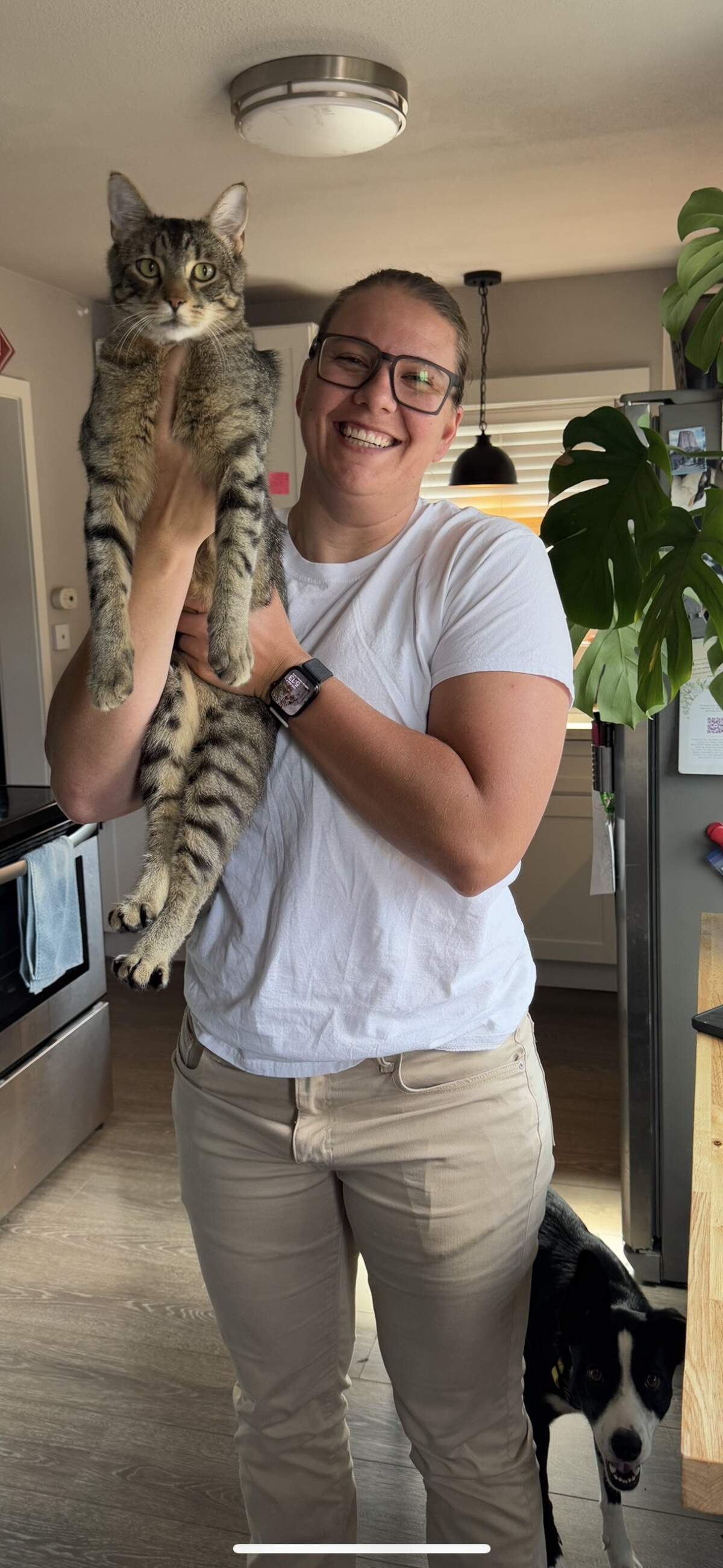Alex Lipston, 31, poses with her 21-month-old cat, Benny, on Aug. 7, 2025 -- eight months after he went missing.