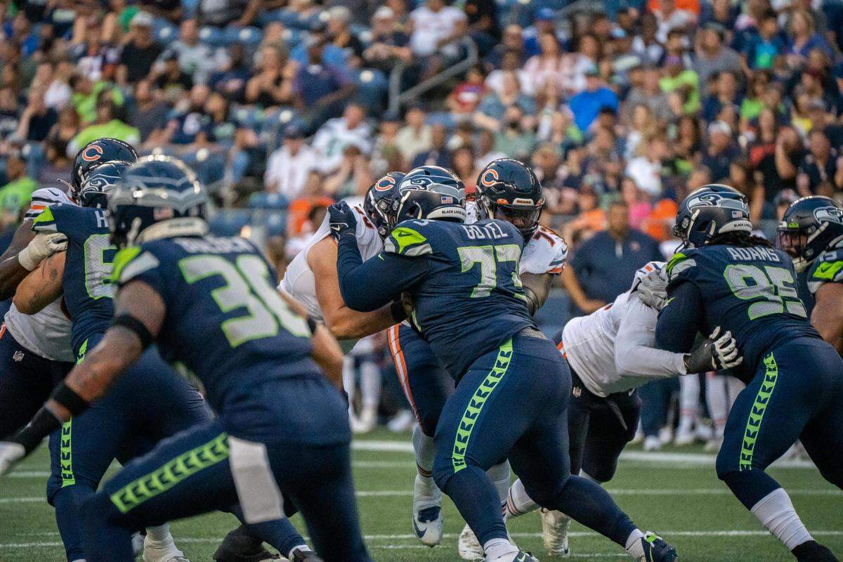 Seattle Seahawks defensive tackle Matt Gotel holds off Chicago Bears offensive linemen Dieter Eiselen during the third quarter of their first home preseason game against the Chicago Bears in Lumen Field on Aug. 18, 2022.