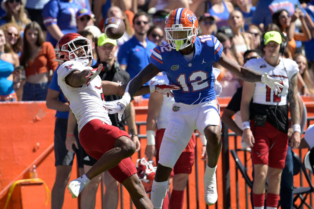 Eastern Washington defensive back Marlon Jones Jr. (20) breaks up a pass intended for Florida wide receiver Caleb Douglas (12) during the second half of an NCAA college football game, Sunday, Oct. 2, 2022, in Gainesville, Fla. (AP Photo/Phelan M. Ebenhack)