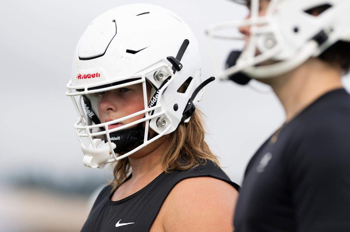 Sumner center Luke Richardson listens to coaches during a football practice at Sumner High School, on Thursday, Aug. 22, 2024, in Sumner, Wash.