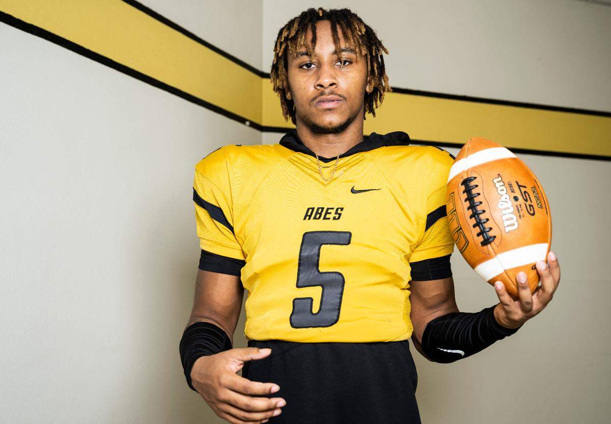 Lincoln senior and varsity football quarterback Gabarri Johnson poses for a portrait after being selected as the player of the year for The News Tribune’s 2022 All-Area football team, at Lincoln High School in Tacoma, Wash. on Dec. 8, 2022.