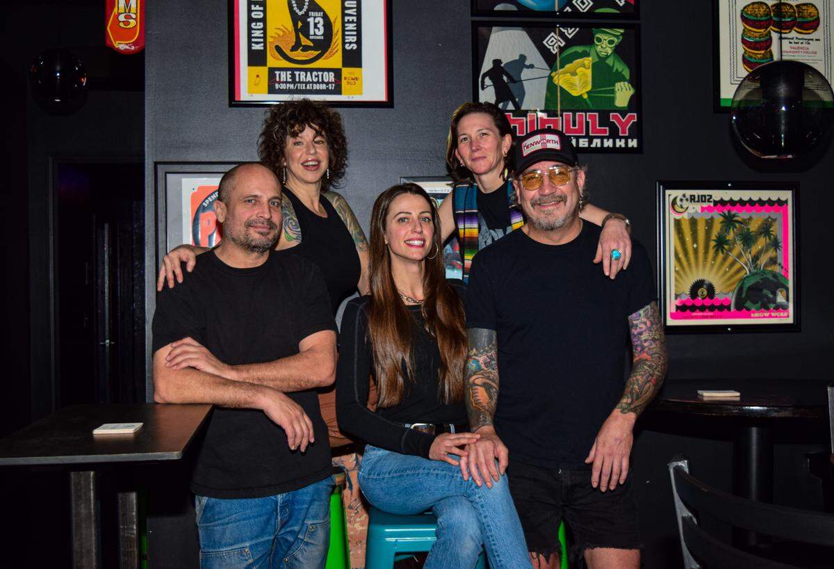 The Huckleberry Club opened in late September in Hilltop. Owners Jason and JaimeKay Jones (left) with Joy Wyrick (back right), Greg Rodriguez and Magdalena Ramos (center) wanted to create an approachable, everyday, neighborhood bar.