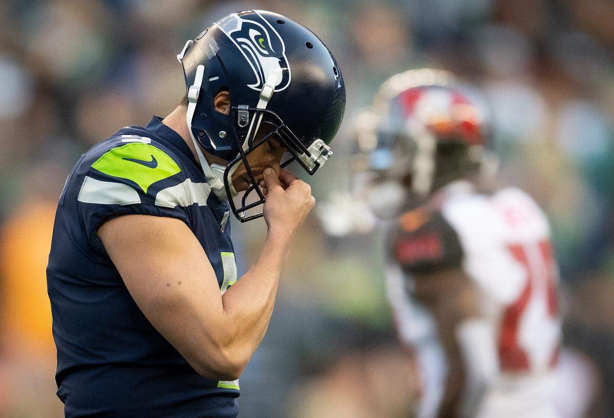 Seattle Seahawks kicker Jason Myers (5) holds his nose after missing the potential game-winning field goal. The Seattle Seahawks played the Tampa Bay Buccaneers in a NFL football game at CenturyLink Field in Seattle, Wash., on Sunday, Nov. 3, 2019.