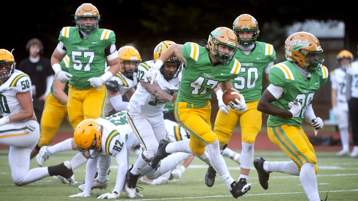 Tumwater running back Mathias Rodriguez breaks away from Sehome linebacker Solomon III Mcalister during Saturday afternoon’s state playoff game at Tumwater District Stadium in Tumwater, Washington, on Friday, Nov. 23, 2024. Tumwater won the game, 70-7, to advance to the state semifinals.